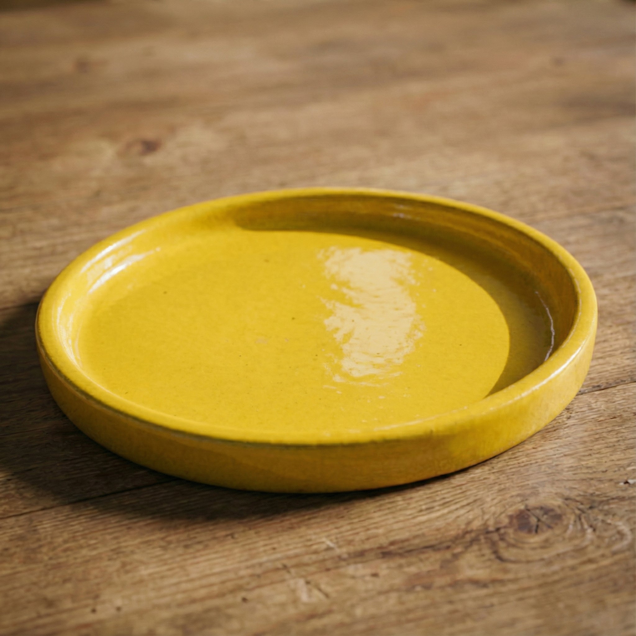 24cm yellow saucer handmade in glazed terracotta