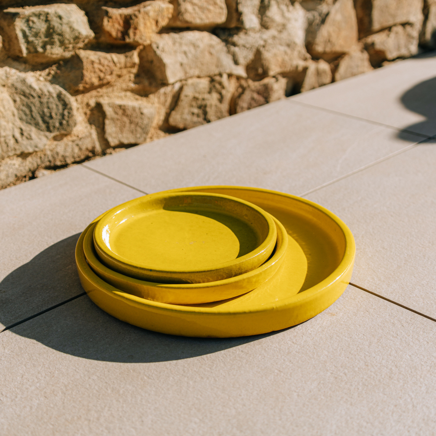 24cm yellow saucer handmade in glazed terracotta