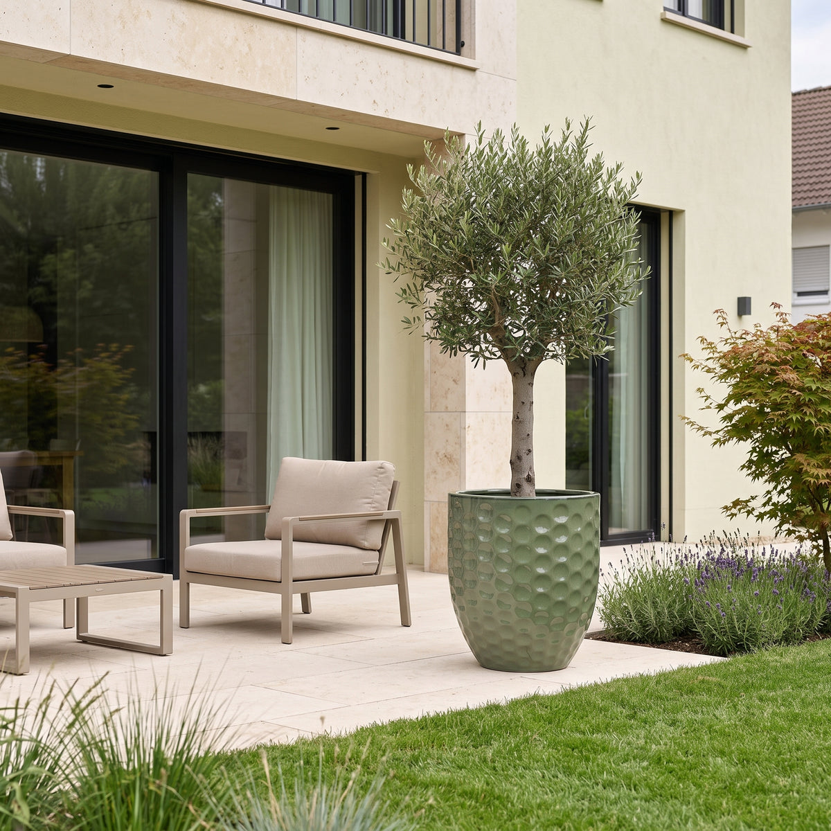 Merovee planter 55x65 cm Jade Pearl glazed ceramic, on terrace in front of house with olive tree