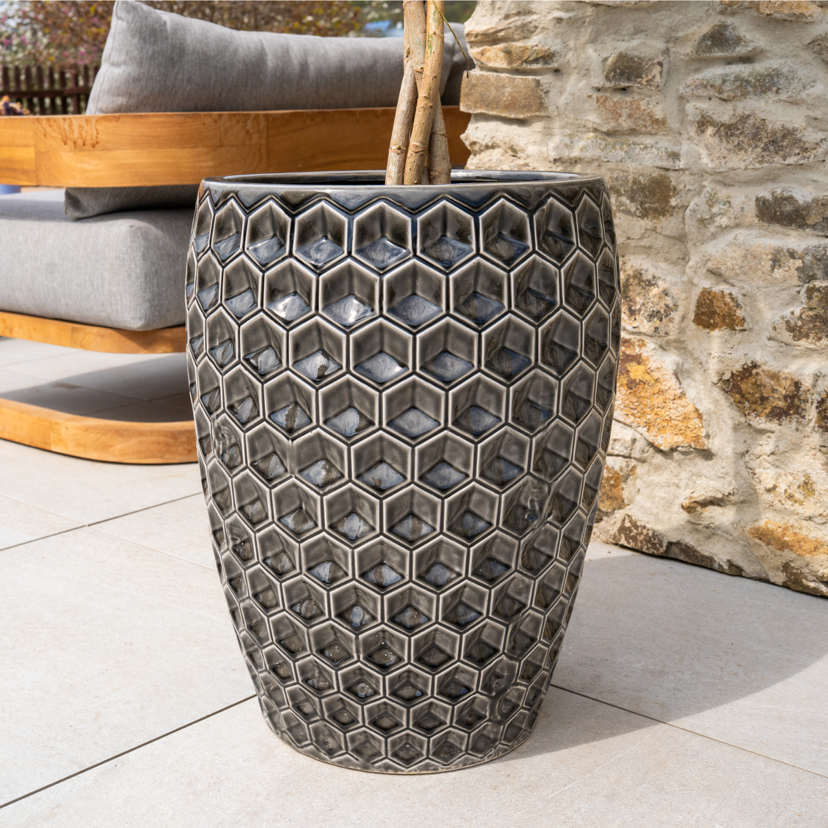 Decorative Versailles 38x54 cm Black glazed ceramic planter, close-up with tree trunk